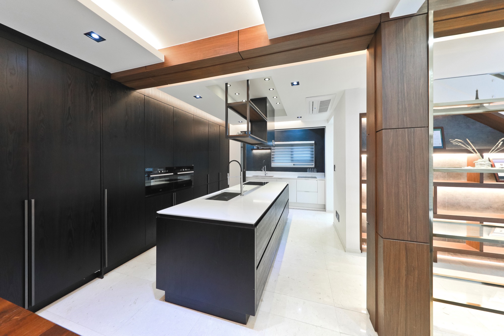 A bespoke kitchen with island and timber cabinetry